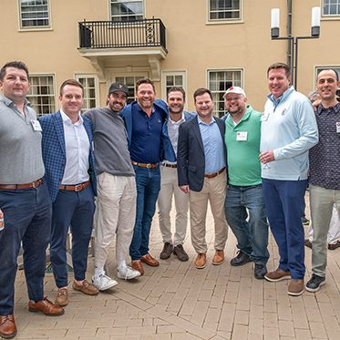 Alumni taking a photo together. Alumni taking a photo together.