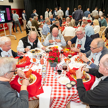 People eating at a table. People eating at a table.